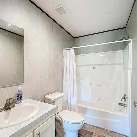 a view of a livingroom with an empty space and window