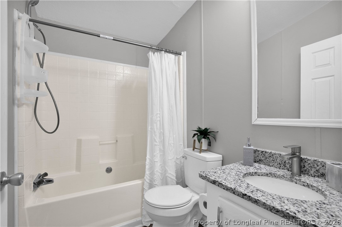 143 South Cherry St Extension Pinebluff, NC 28373 - Photo 17 of 25 a bathroom with a granite countertop sink toilet and shower