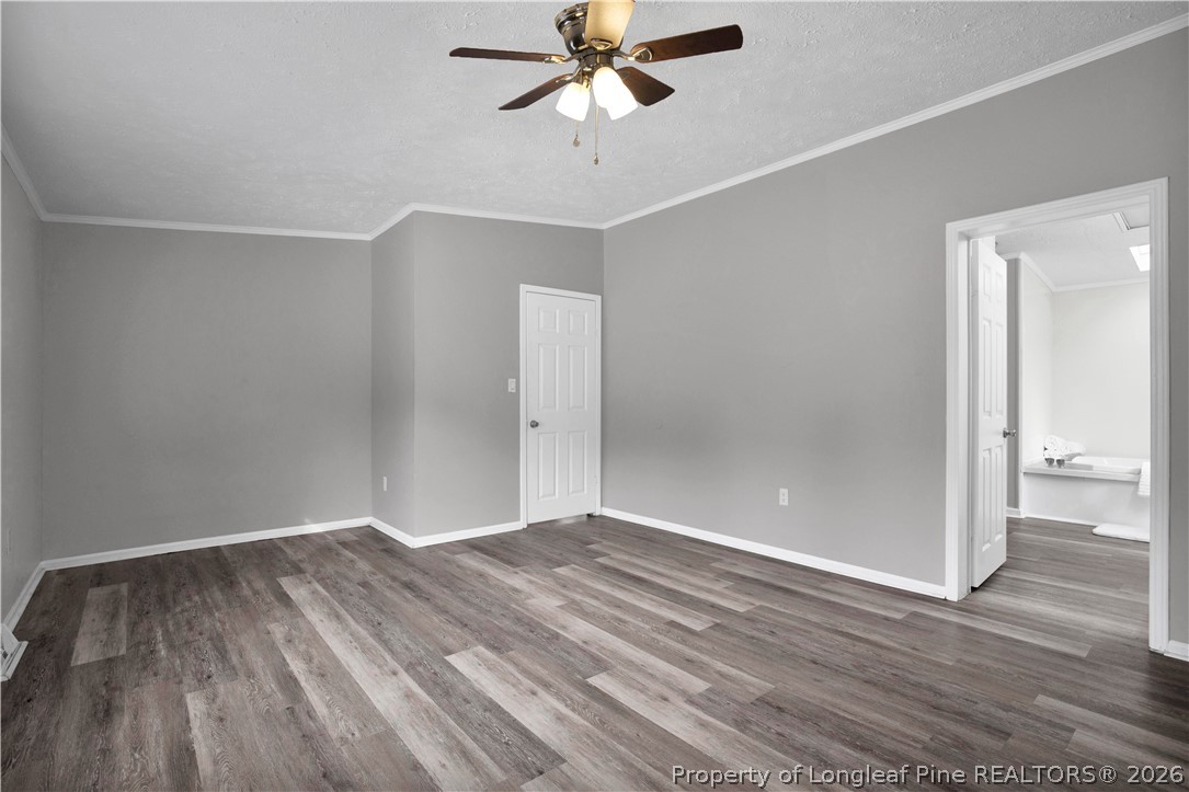 143 South Cherry St Extension Pinebluff, NC 28373 - Photo 20 of 25 wooden floor in an empty room with a window