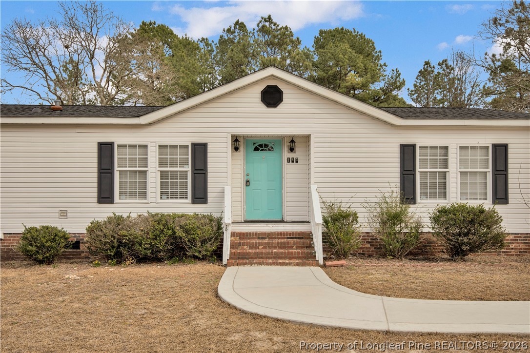 143 South Cherry St Extension Pinebluff, NC 28373 - Photo 2 of 25 a front view of a house with garden