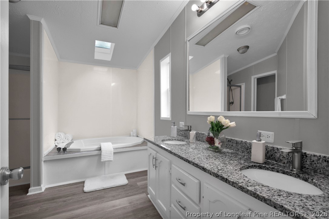 143 South Cherry St Extension Pinebluff, NC 28373 - Photo 21 of 25 a bathroom with a granite countertop sink and a mirror