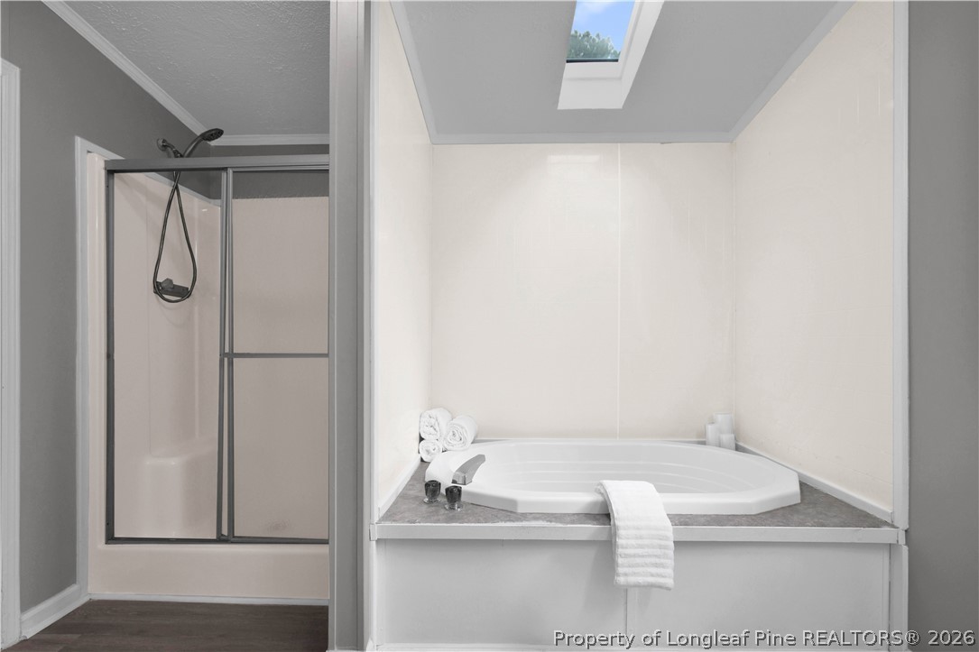 143 South Cherry St Extension Pinebluff, NC 28373 - Photo 22 of 25 a bathroom with a tub and a shower