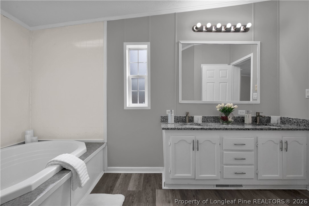 143 South Cherry St Extension Pinebluff, NC 28373 - Photo 23 of 25 a bathroom with a granite countertop sink and a mirror