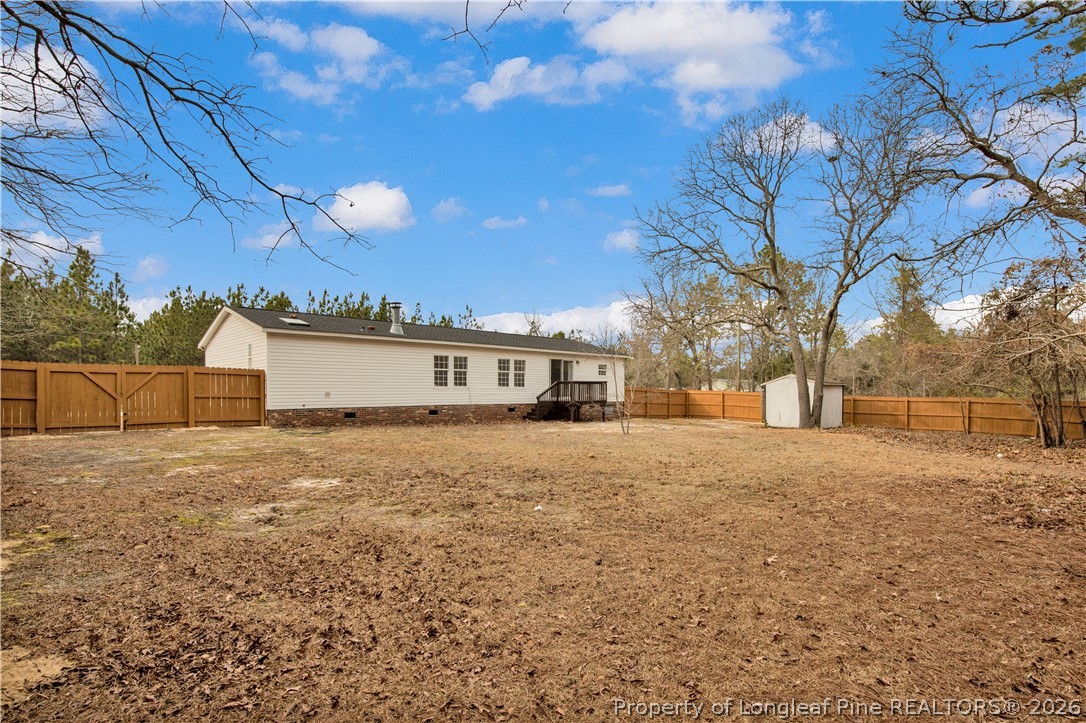143 South Cherry St Extension Pinebluff, NC 28373 - Photo 25 of 25 a white house that has a tree in front of it