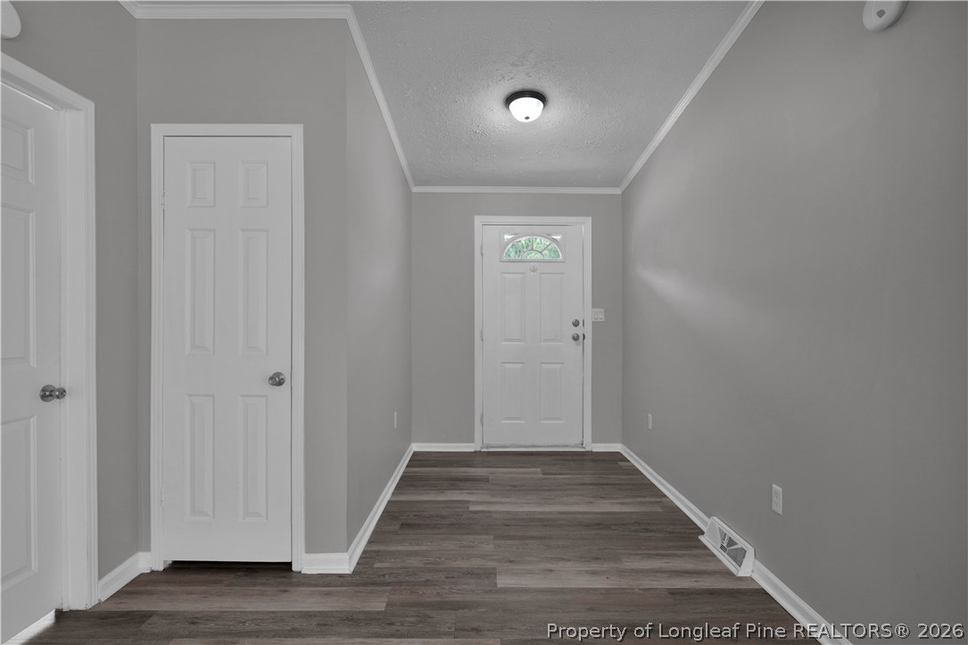 143 South Cherry St Extension Pinebluff, NC 28373 - Photo 3 of 25 a view of a hallway with wooden floor