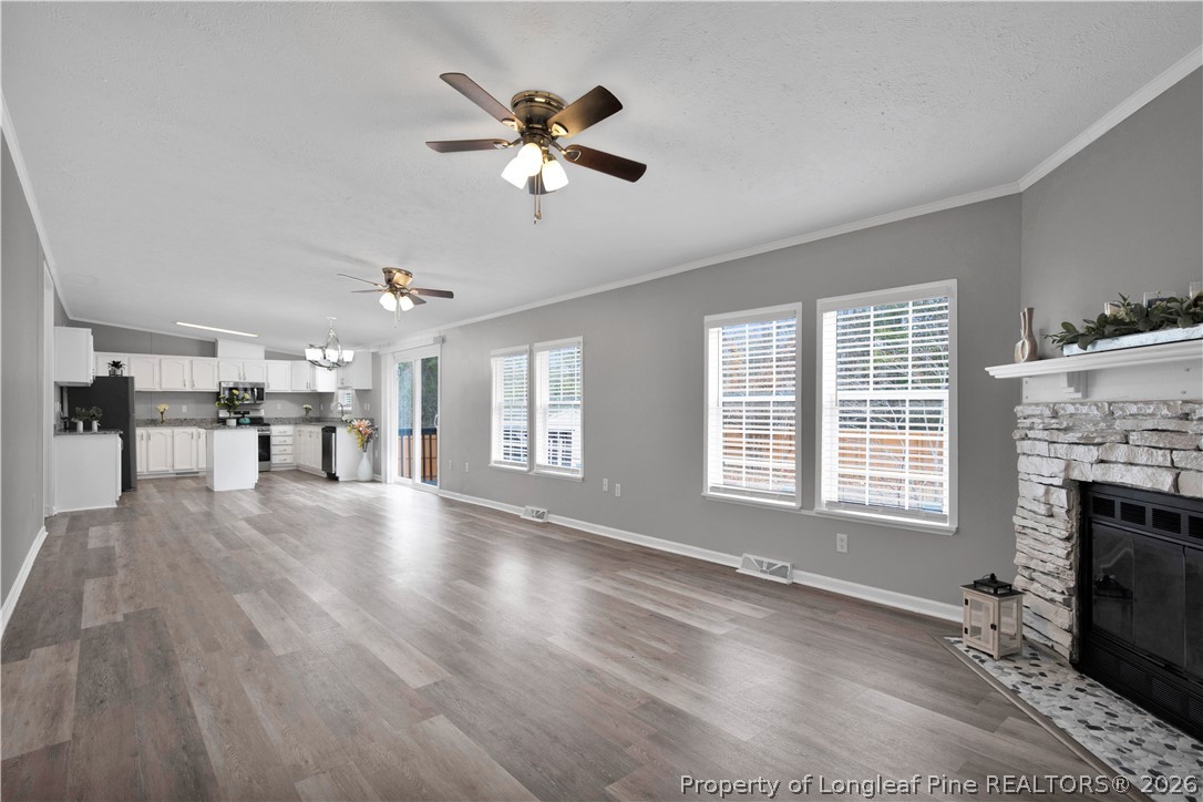 143 South Cherry St Extension Pinebluff, NC 28373 - Photo 6 of 25 a view of an empty room with wooden floor and a window