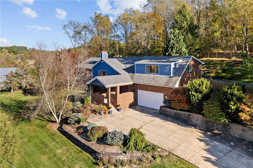 a view of a house with roof deck front of house
