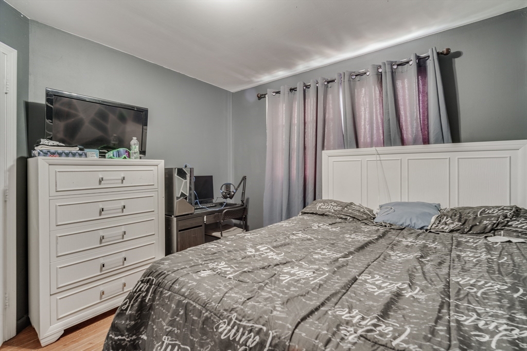 18 Chester Street Springfield, MA 01105 - Photo 29 of 41 a bedroom with a bed and a television