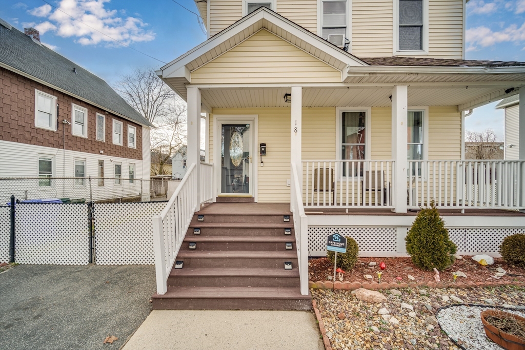 18 Chester Street Springfield, MA 01105 - Photo 3 of 41 a view of a house with wooden floor and a large tree