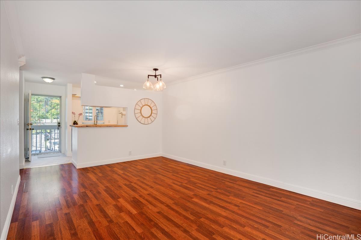 95-668 Wikao Street, Unit J204 Mililani, HI 96789 - Photo 1 of 1 a big room with wooden floor and windows