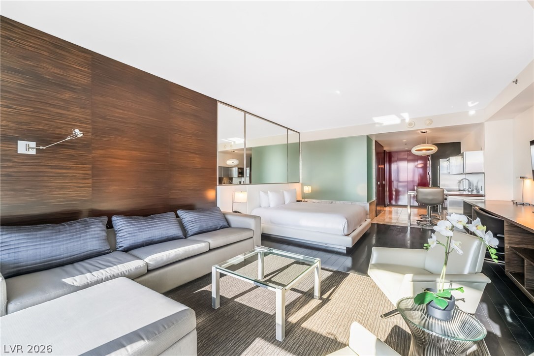 4381 West Flamingo Road, Unit 18305 Las Vegas, NV 89103 - Photo 13 of 19 Integrated living, sleeping, and kitchen spaces define this bright, efficient studio layout.