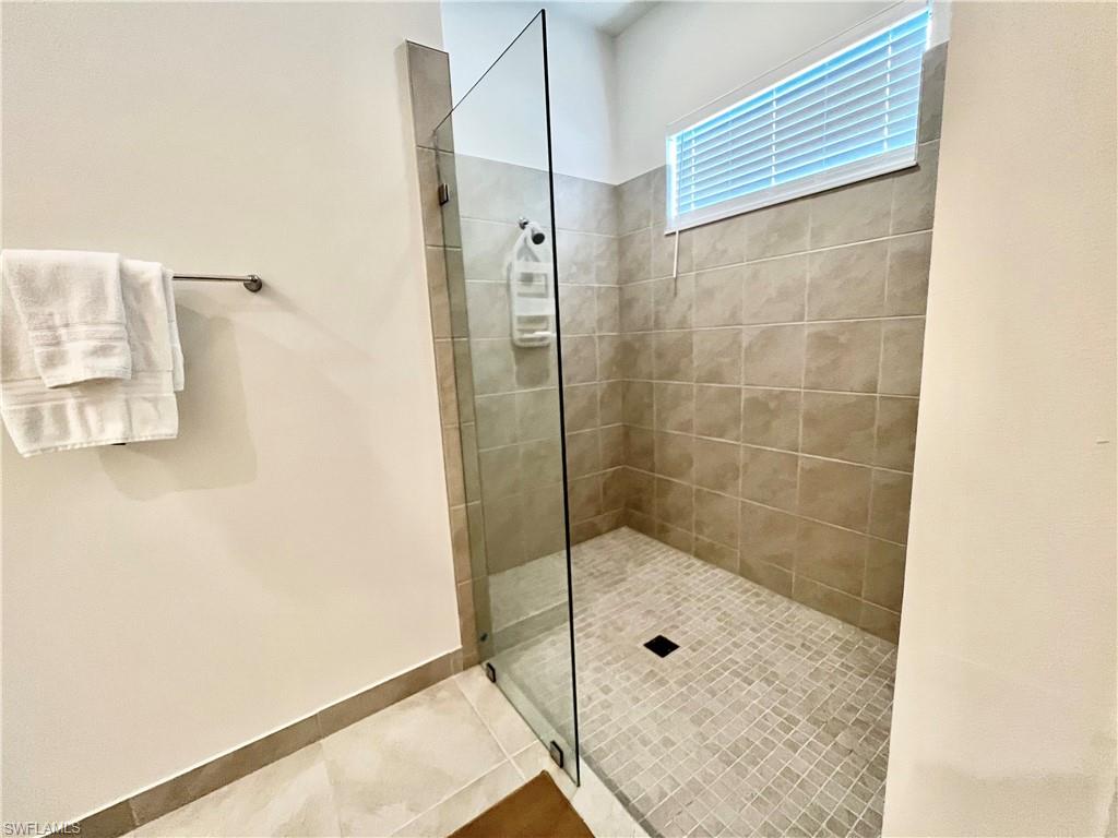 5015 Frattina St Avenue Immokalee, FL 34142 - Photo 13 of 23 a bathroom with a shower