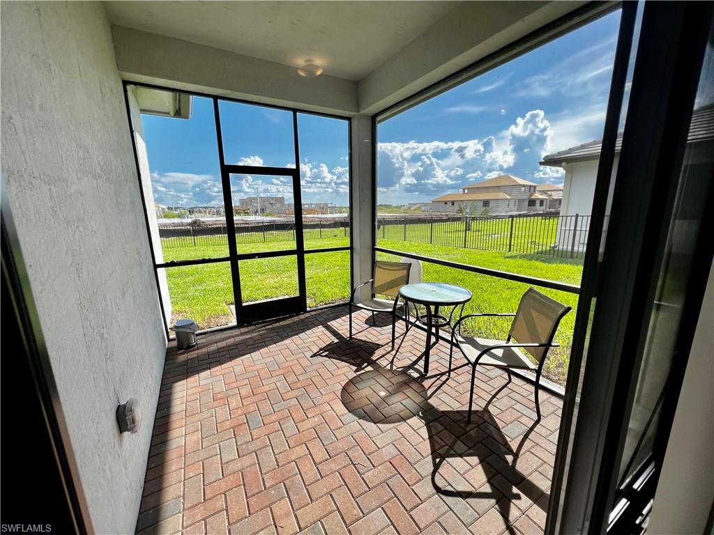 5015 Frattina St Avenue Immokalee, FL 34142 - Photo 17 of 23 a view of a chairs and table in the balcony