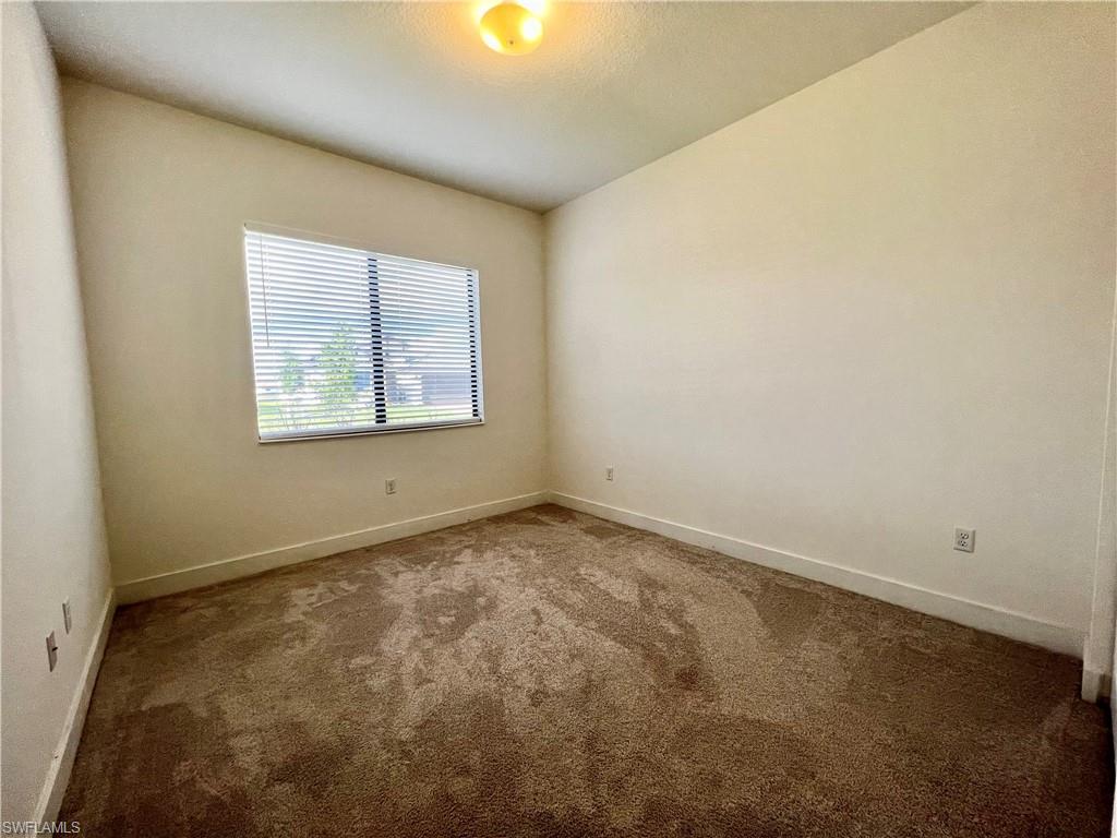 5015 Frattina St Avenue Immokalee, FL 34142 - Photo 9 of 23 an empty room with a window