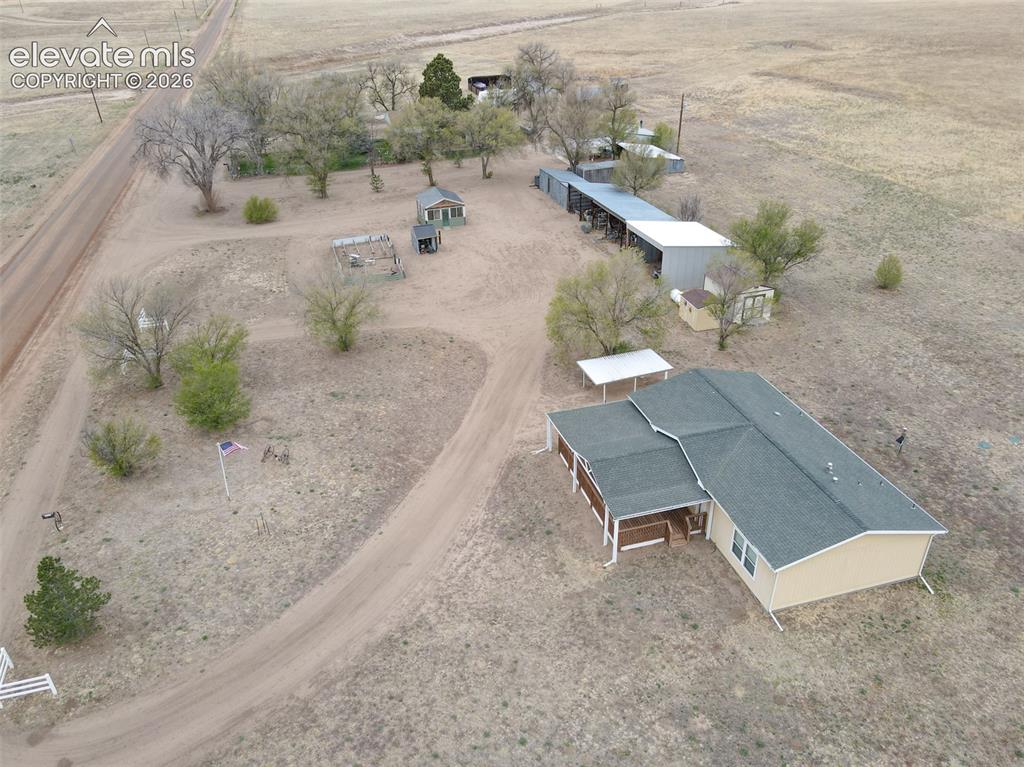 22558 Enoch Road Calhan, CO 80808 - Photo 50 of 50 an aerial view of a house with a yard and lake