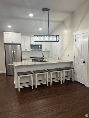 1768 West 1300th Street South, Unit 305 Springville, UT 84663 - Photo 5 of 26 Fully remodeled kitchen with new cabinetry, easy care LVP flooring, granite countertops, and stainless steel appliance.