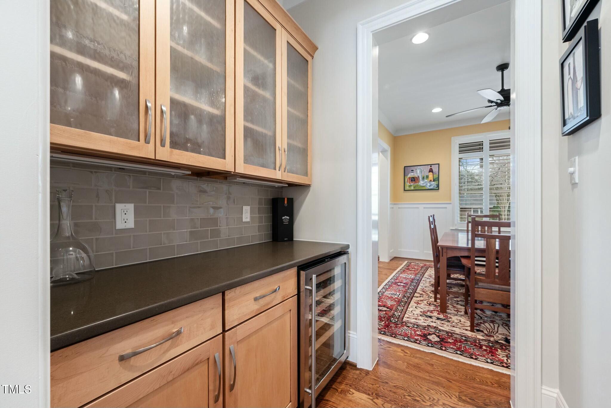 519 Peebles Street Raleigh, NC 27608 - Photo 14 of 43 a kitchen with stainless steel appliances granite countertop a stove and a sink