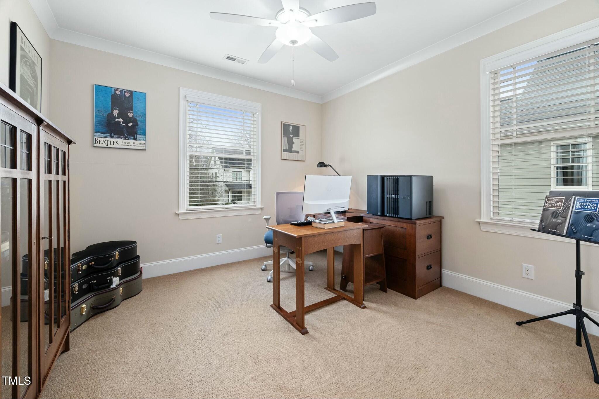519 Peebles Street Raleigh, NC 27608 - Photo 24 of 43 a view of a workspace with furniture and a window