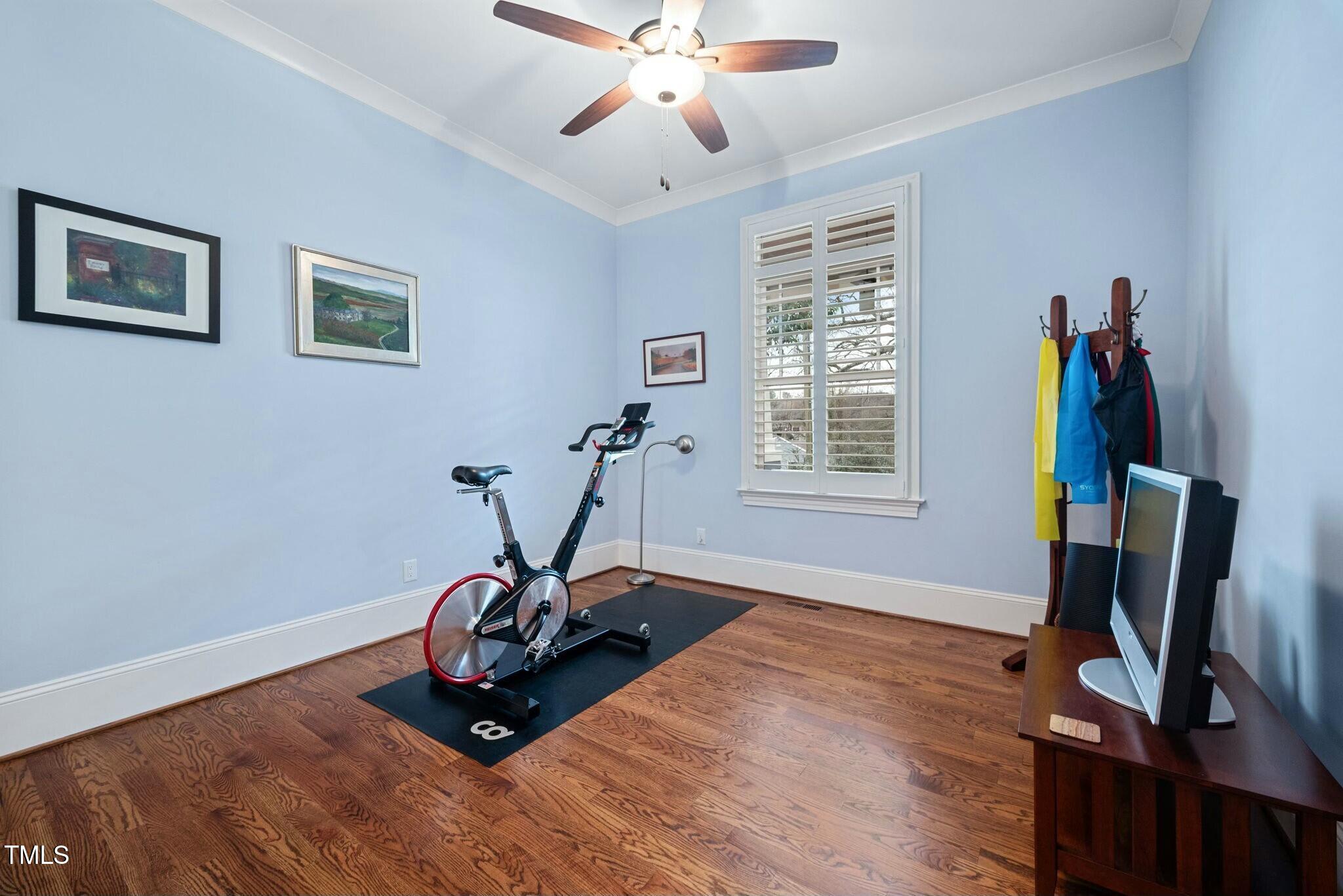 519 Peebles Street Raleigh, NC 27608 - Photo 27 of 43 a room with gym equipment and a window