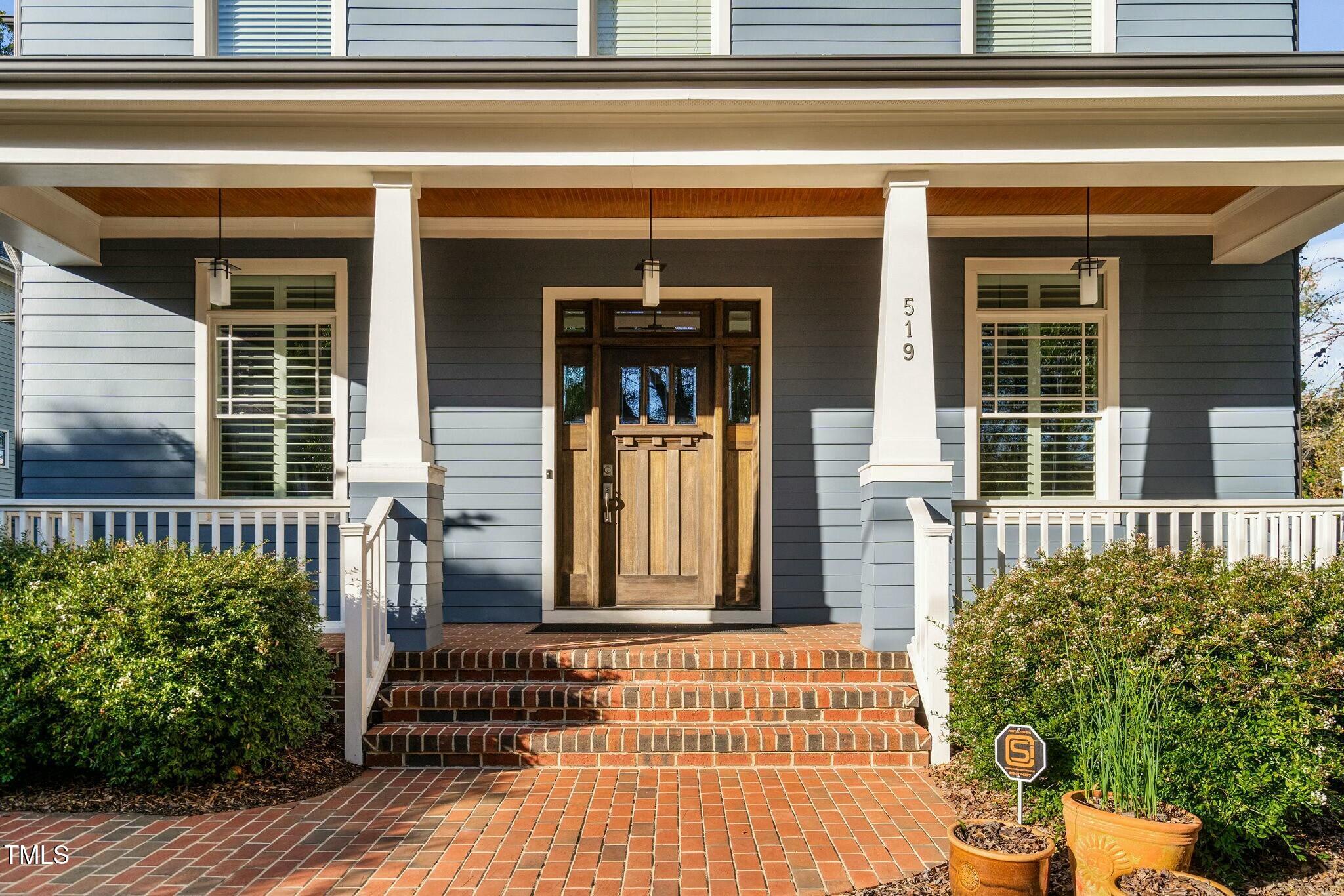 519 Peebles Street Raleigh, NC 27608 - Photo 3 of 43 a front view of a house with a porch