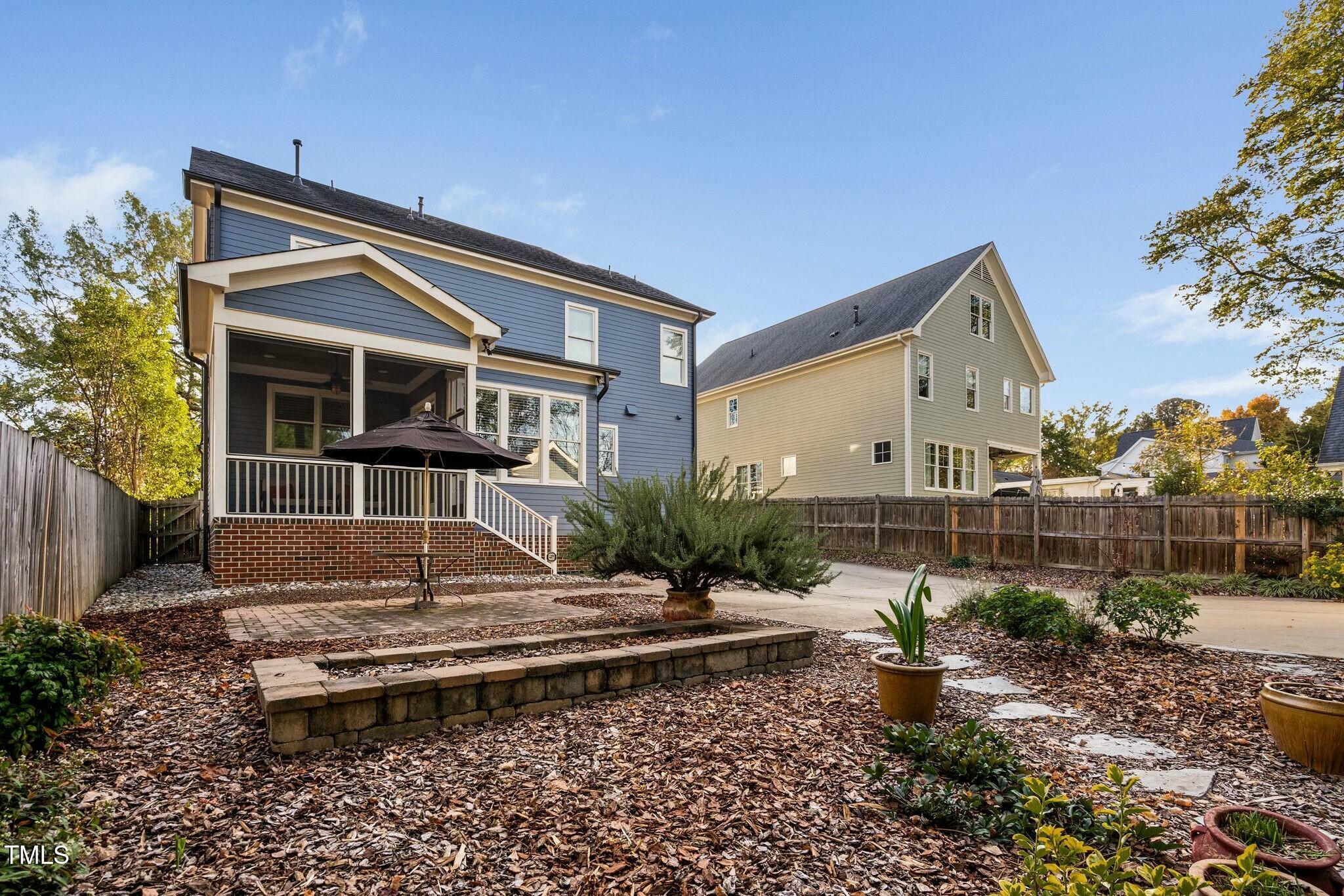 519 Peebles Street Raleigh, NC 27608 - Photo 37 of 43 a front view of a house with a yard