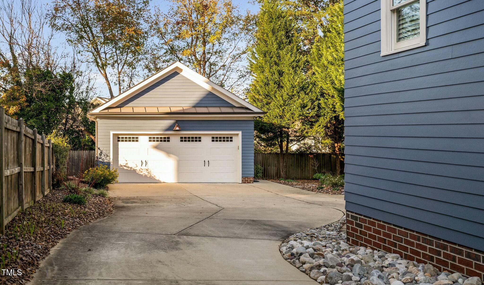 519 Peebles Street Raleigh, NC 27608 - Photo 40 of 43 a front view of a house with a yard and garage