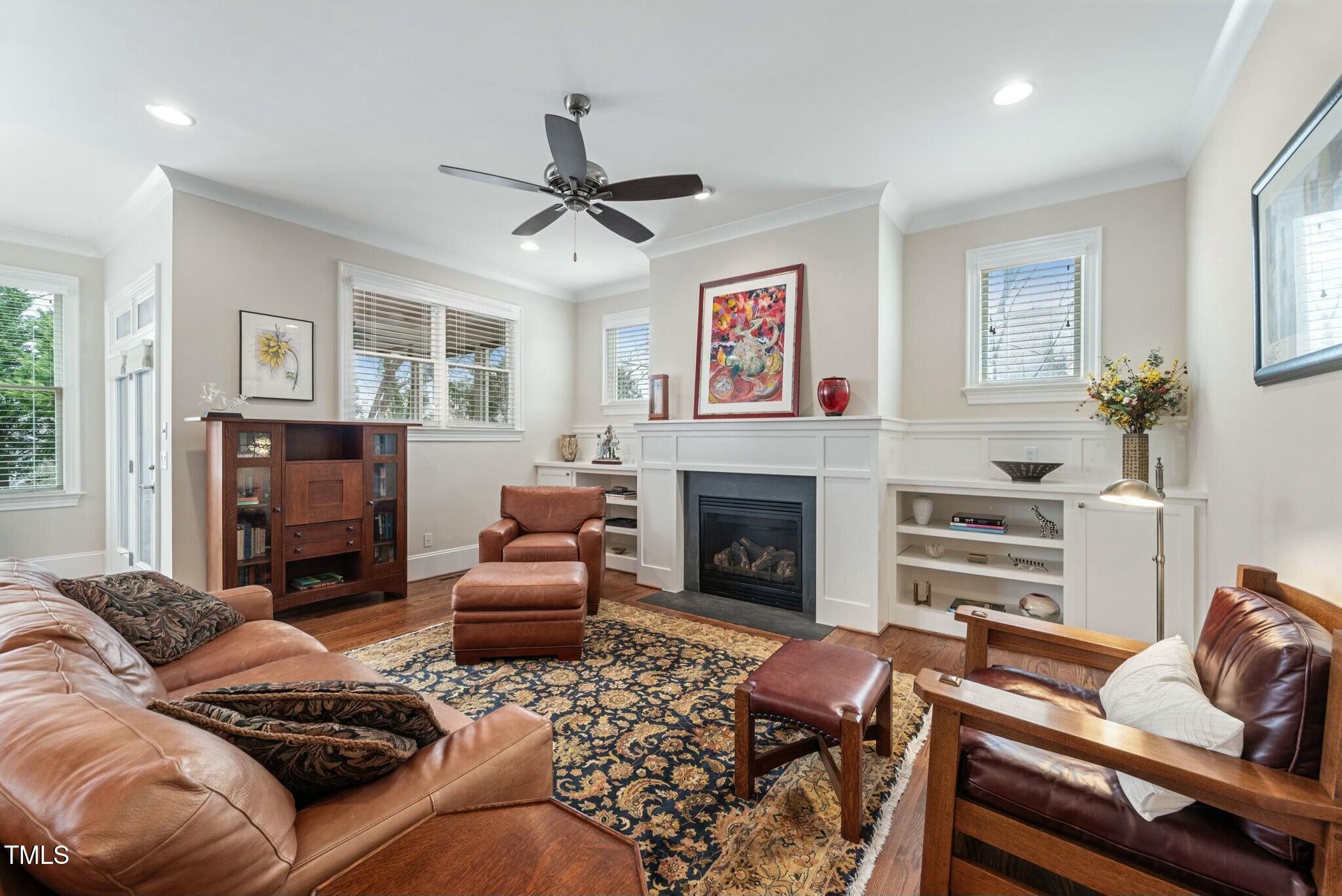 519 Peebles Street Raleigh, NC 27608 - Photo 6 of 43 a living room with furniture or couch and a fireplace