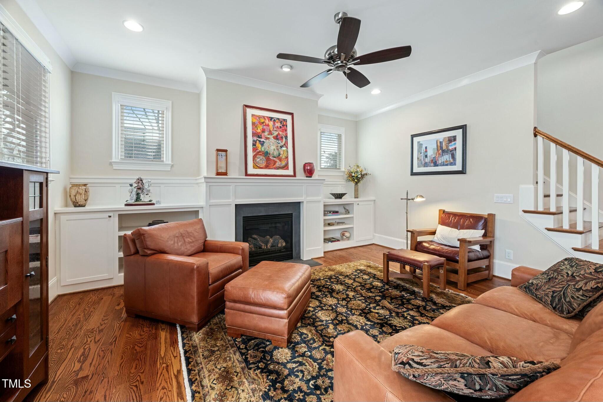 519 Peebles Street Raleigh, NC 27608 - Photo 7 of 43 a living room with furniture and a fireplace