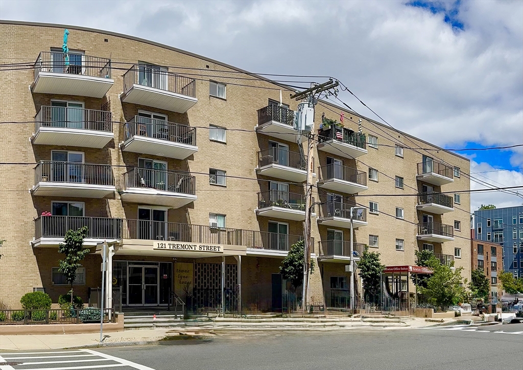 a front view of a building with a street