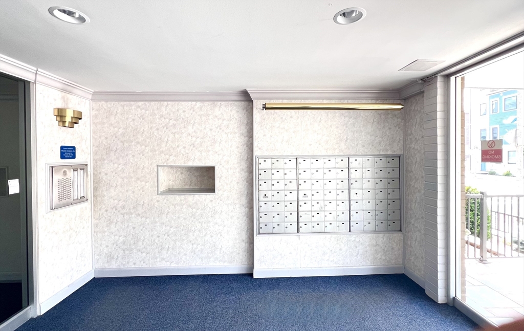 121 Tremont Street, Unit B1 Boston, MA 02135 - Photo 4 of 20 a view of an empty room with a window