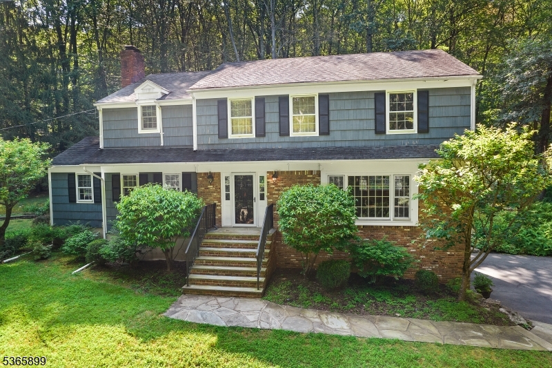 67 Frog Hollow Road Califon, NJ 07830 - Photo 1 of 31 a front view of a house with a yard