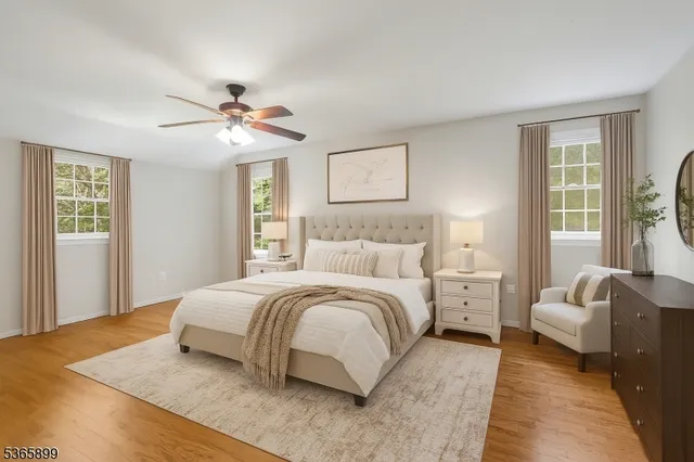 a spacious bedroom with a bed and a couch