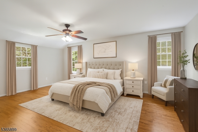 67 Frog Hollow Road Califon, NJ 07830 - Photo 20 of 31 a spacious bedroom with a bed and a couch