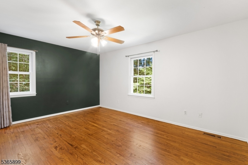 67 Frog Hollow Road Califon, NJ 07830 - Photo 26 of 31 a view of an empty room with wooden floor and a window