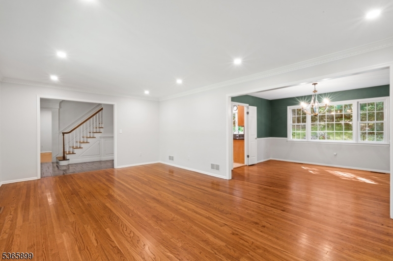 67 Frog Hollow Road Califon, NJ 07830 - Photo 5 of 31 a view of an empty room with a window and wooden floor