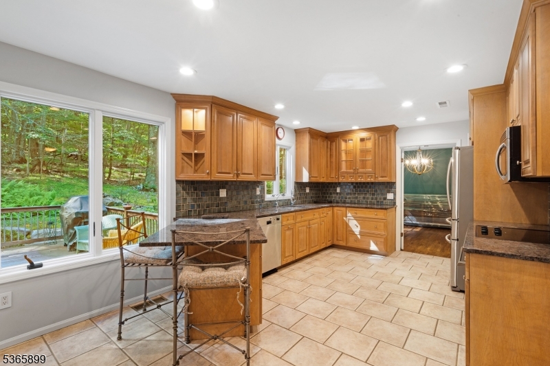 67 Frog Hollow Road Califon, NJ 07830 - Photo 9 of 31 a kitchen with a sink and chairs