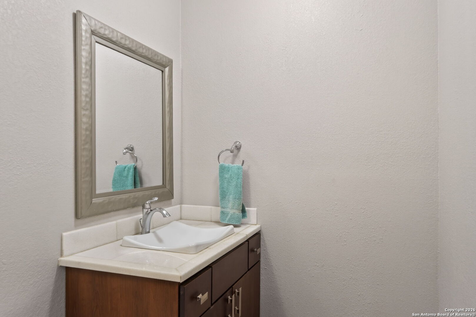 11001 Wurzbach Road, Unit 605 San Antonio, TX 78230 - Photo 27 of 47 a bathroom with a sink and a mirror