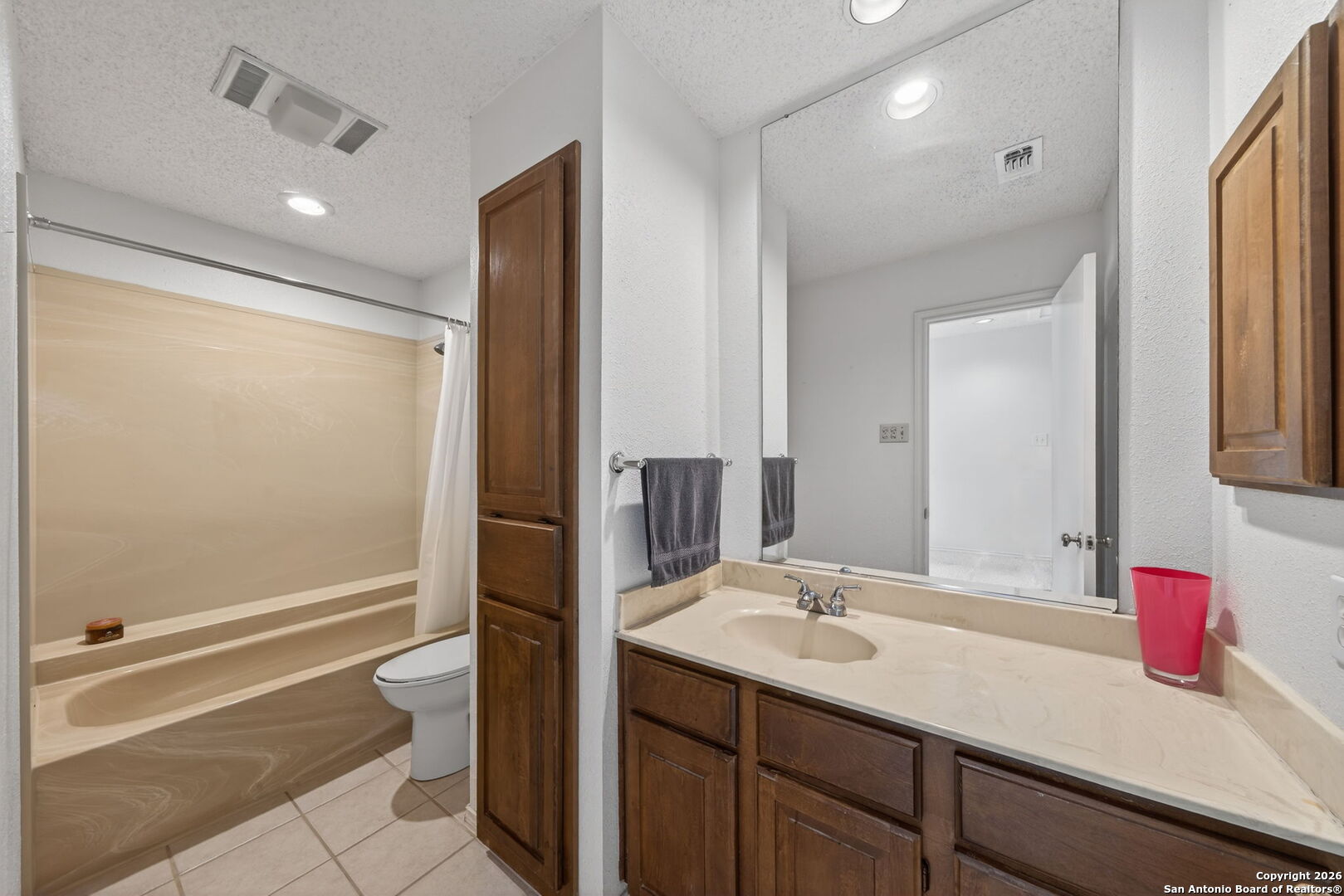 11001 Wurzbach Road, Unit 605 San Antonio, TX 78230 - Photo 31 of 47 a bathroom with a sink and a mirror