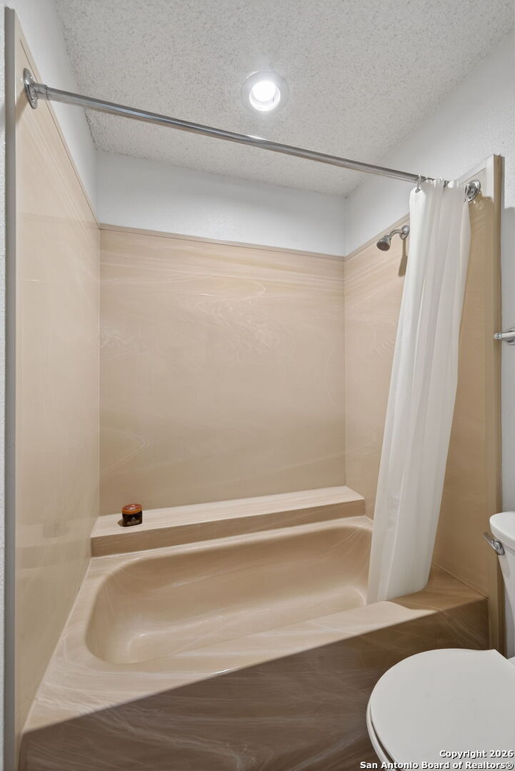 11001 Wurzbach Road, Unit 605 San Antonio, TX 78230 - Photo 32 of 47 a bathroom with a shower and a toilet