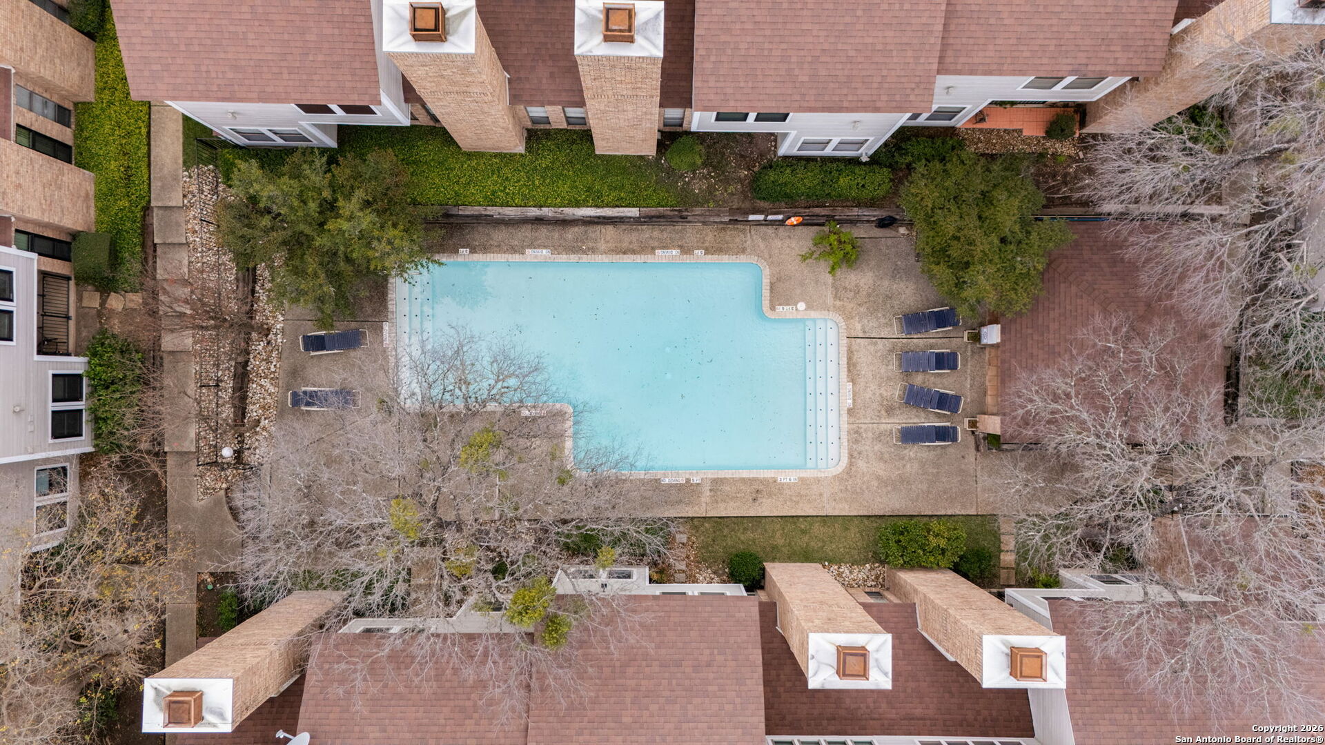11001 Wurzbach Road, Unit 605 San Antonio, TX 78230 - Photo 35 of 47 an aerial view of a house with a yard