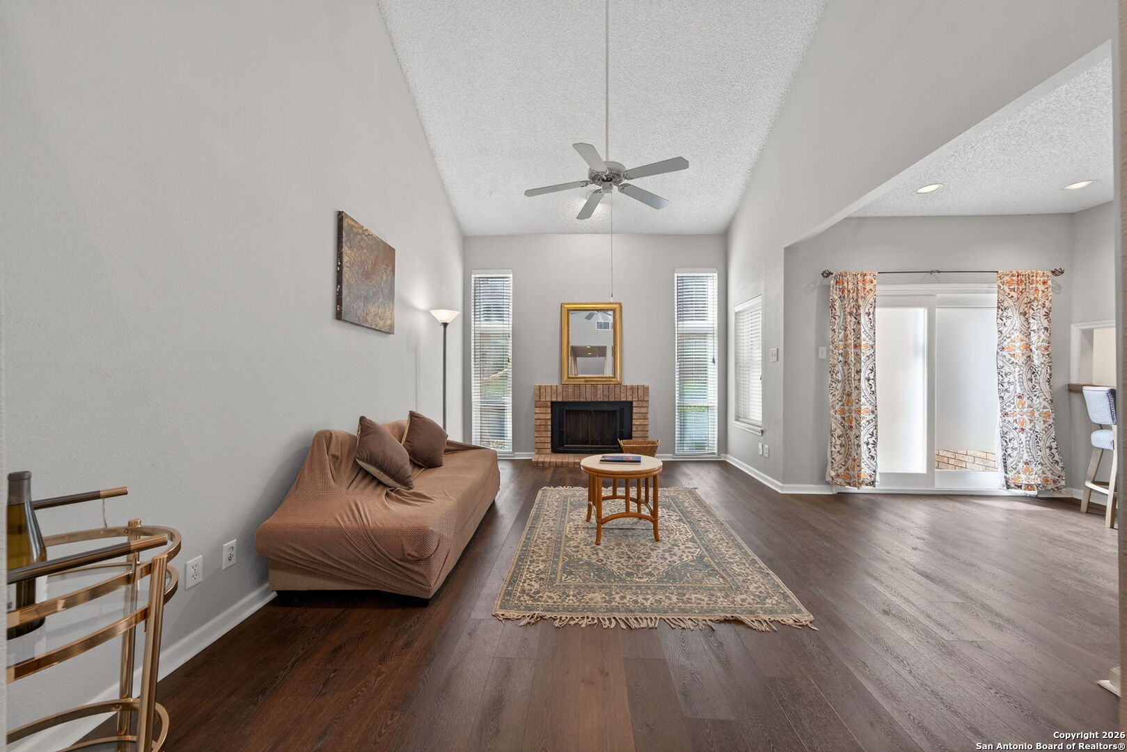 11001 Wurzbach Road, Unit 605 San Antonio, TX 78230 - Photo 4 of 47 a living room with furniture and a fireplace