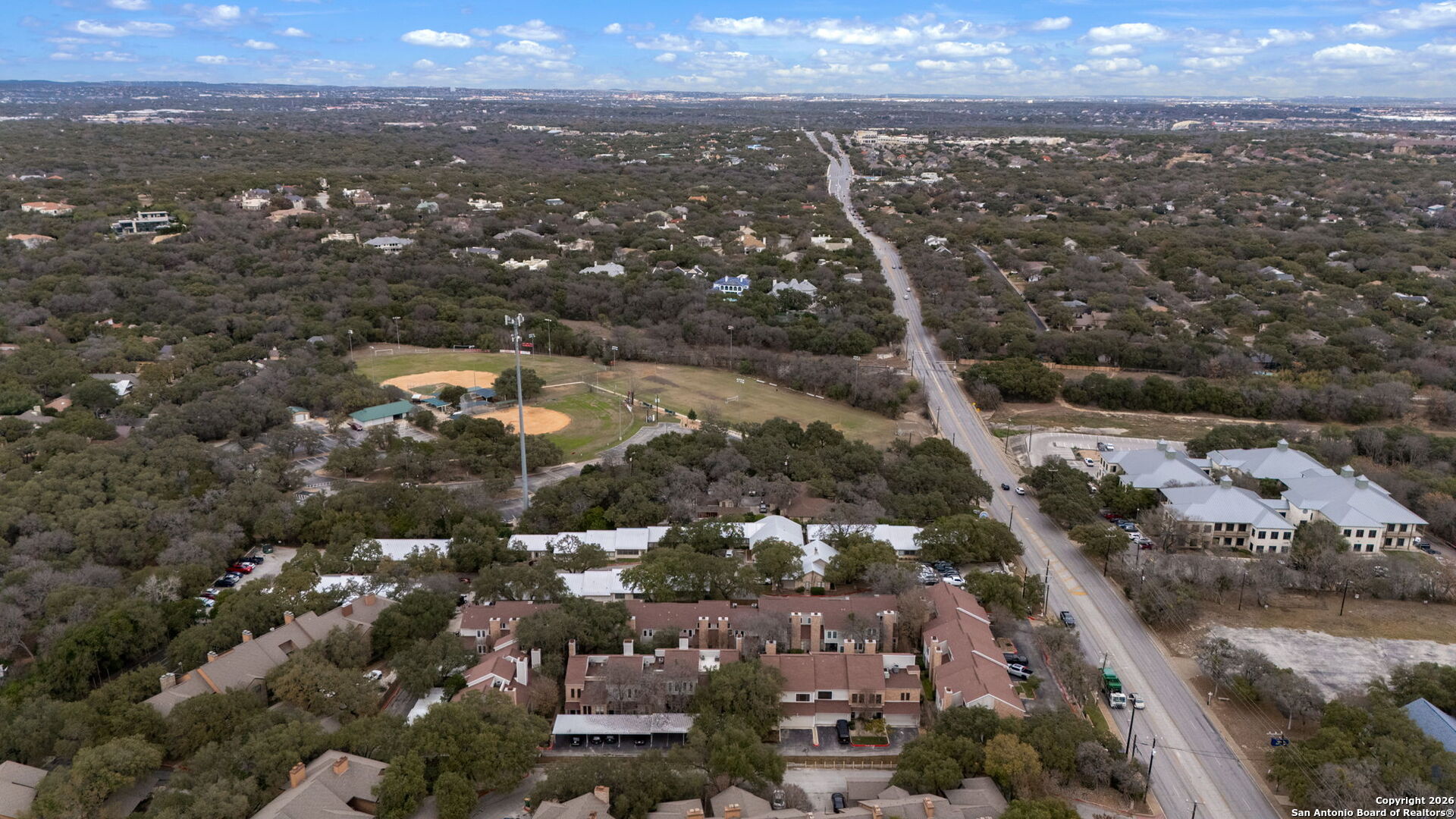 11001 Wurzbach Road, Unit 605 San Antonio, TX 78230 - Photo 44 of 47 an aerial view of city and lake