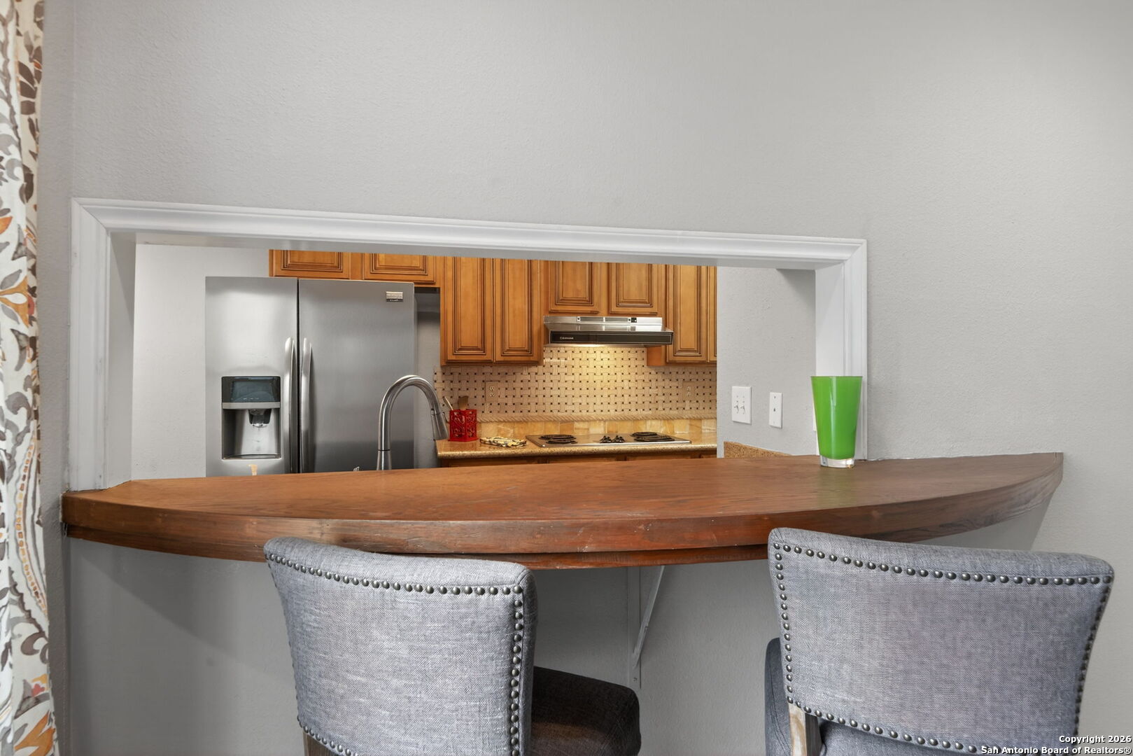 11001 Wurzbach Road, Unit 605 San Antonio, TX 78230 - Photo 8 of 47 a kitchen with stainless steel appliances granite countertop a sink a stove and a refrigerator