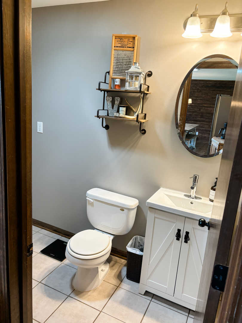 16725 O Brien Road Minooka, IL 60447 - Photo 15 of 29 a bathroom with a toilet a sink and mirror
