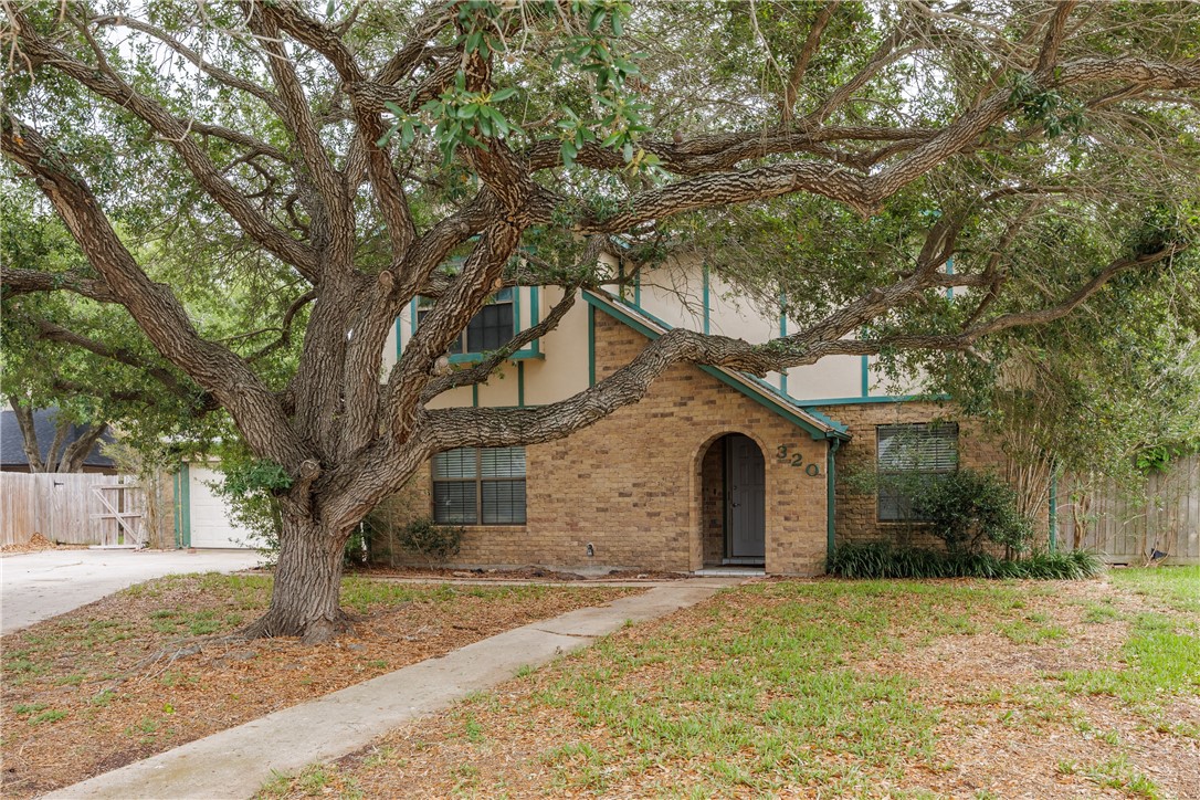 320 Long Point Drive Portland, TX 78374 - Photo 1 of 40 Arrive at this stately two-story residence, framed