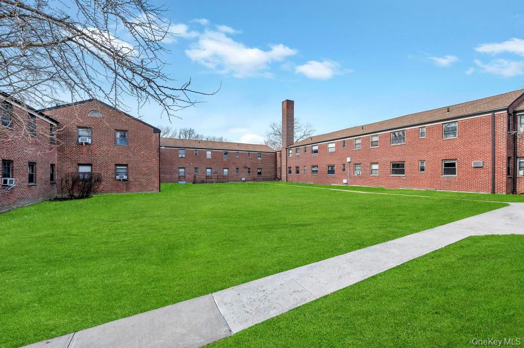 196-72 69th Avenue, Unit 1 Queens, NY 11365 - Photo 20 of 23 Surrounding community featuring a yard