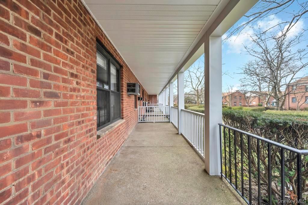 196-72 69th Avenue, Unit 1 Queens, NY 11365 - Photo 21 of 23 Porch with a residential view