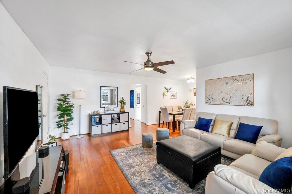 196-72 69th Avenue, Unit 1 Queens, NY 11365 - Photo 6 of 23 Living area featuring ceiling fan and hardwood / wood-style flooring