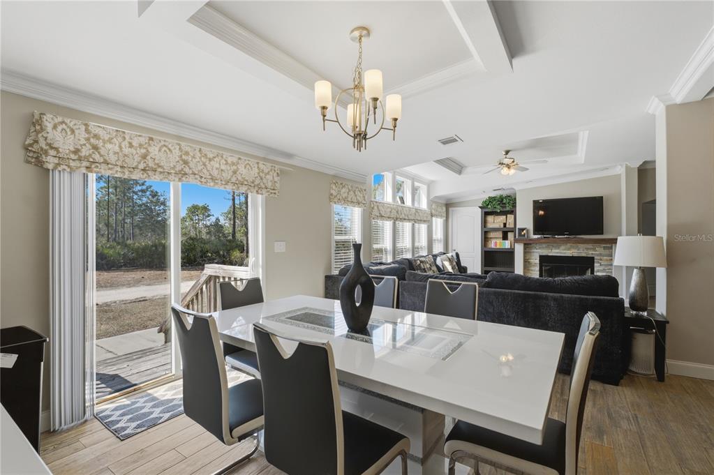6844 Chad Jason Road St. Cloud, FL 34773 - Photo 15 of 59 a view of a dining room with furniture window and wooden floor
