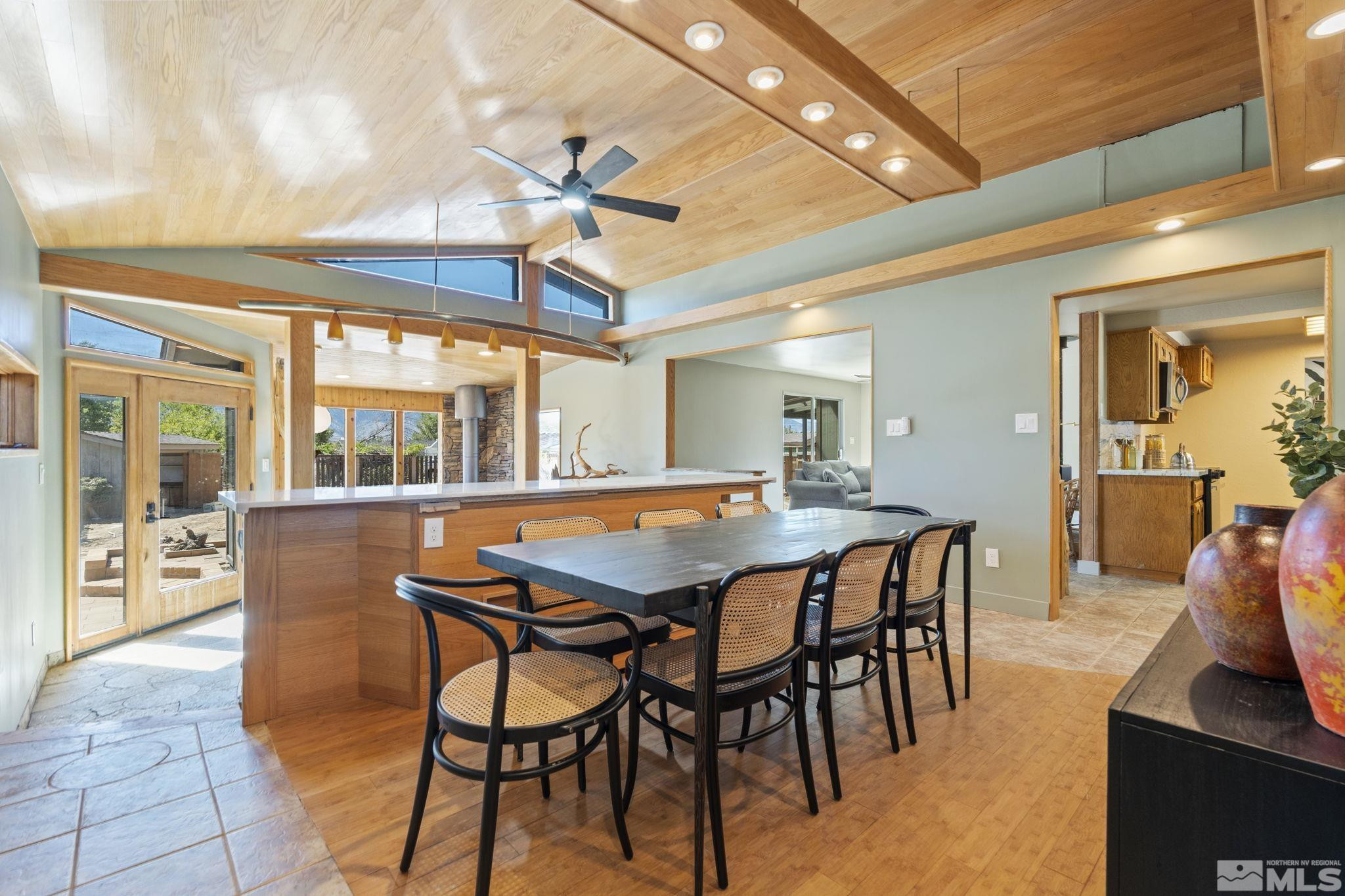 888 Dresslerville Road Gardnerville, NV 89460 - Photo 13 of 35 a dining room with furniture a floor to ceiling window and a chandelier